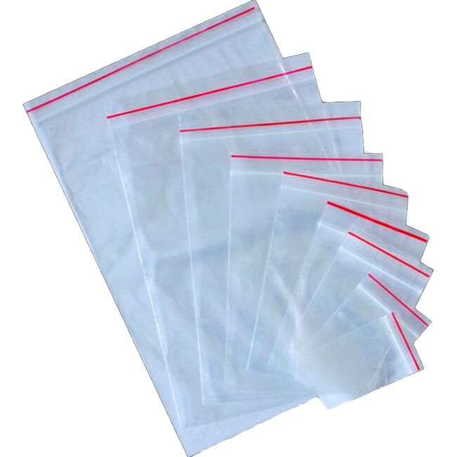 0031486_resealable-plastic-grip-zip-lock-bags-40-microns-15-x-10-cm-pack-of-1000-2g_plmg1015_650 Zip Lock Bags: A collection of transparent, resealable plastic bags in assorted sizes, each featuring a red zip lock strip at the top and displayed overlapping on a white background.